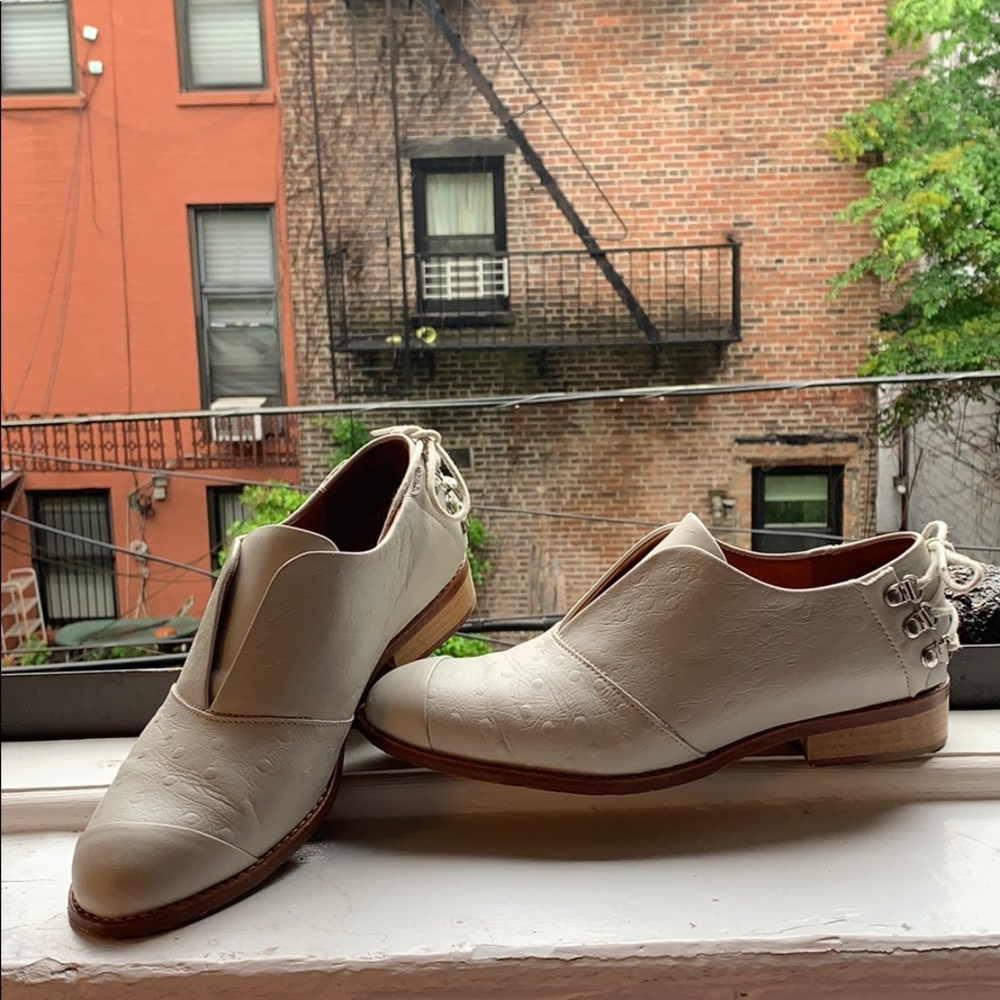 White leather loafers